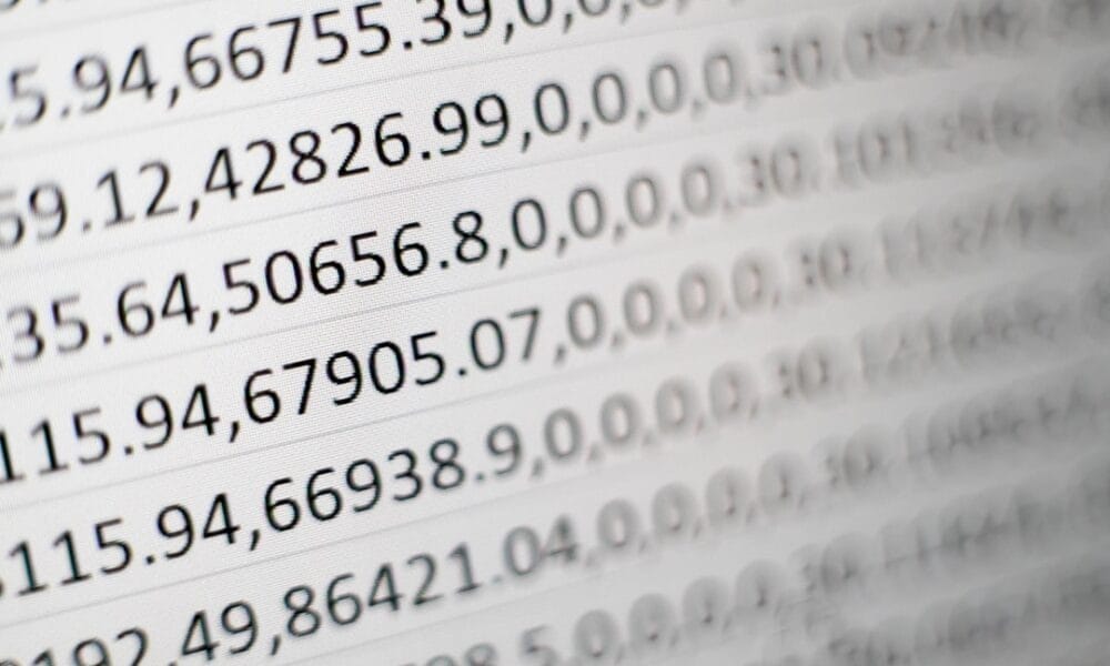 Close-up of a computer screen displaying rows of numerical sports data in a spreadsheet format.